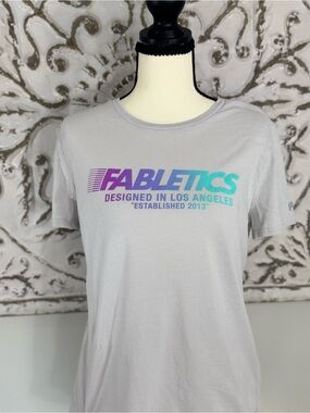 Fabletics Light Gray Tee with Purple-to-Teal Gradient Logo